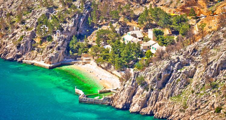 Aerial view of a scenic cove with turquoise water.