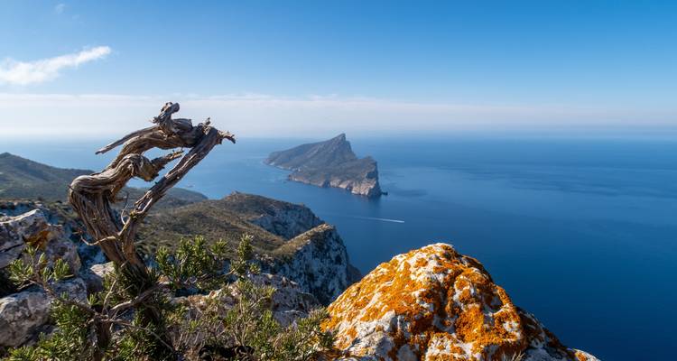 Rocky coastline with an island in the distance.