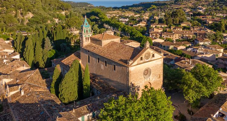 Aerial view of a historical town with a church.