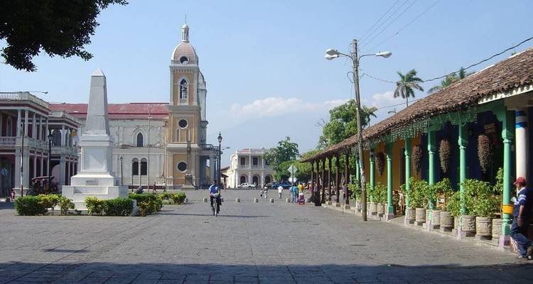Town square with church and colorful buildings.