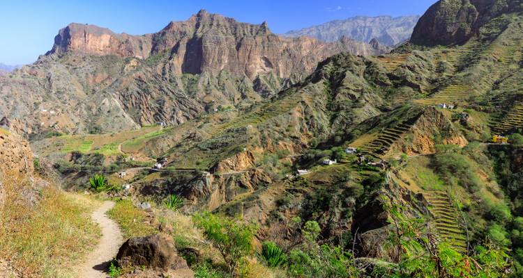 Mountain trail winding through terraced slopes and rugged cliffs on Santo Antão