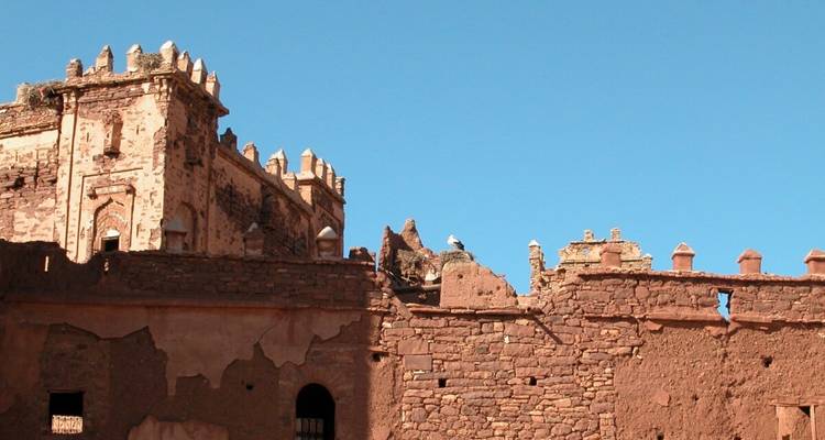 Ruins of an ancient structure made of sandstone.