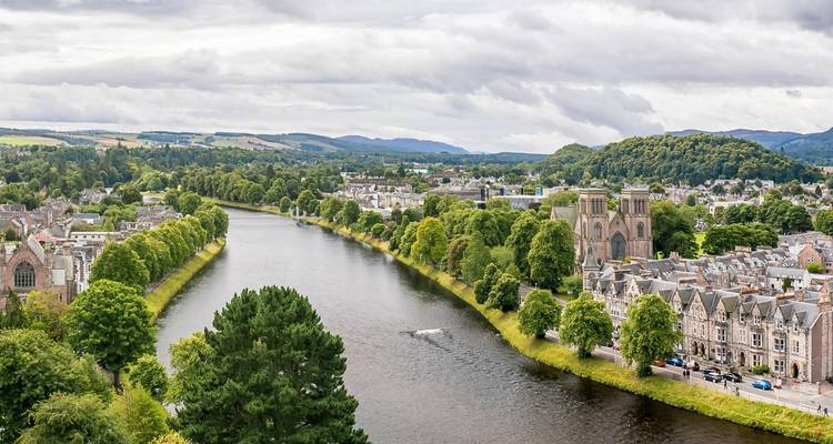 River and cityscape with historical buildings in Scotland.