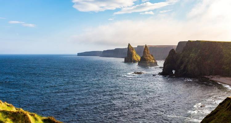 Dramatic coastal cliffs with the ocean below in Scotland.