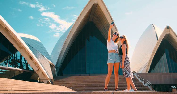 Two women taking a selfie at Sydney Opera House.