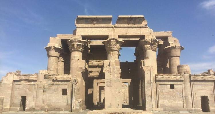 Ancient temple facade with large stone columns.