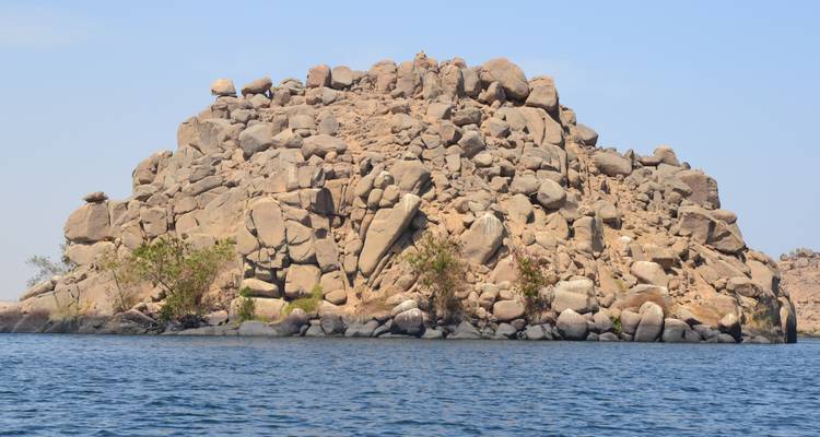 Rocky island surrounded by water.