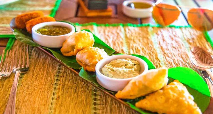 Plate of assorted snacks and sauces.