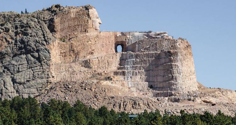 Large mountain carving of a Native American figure.