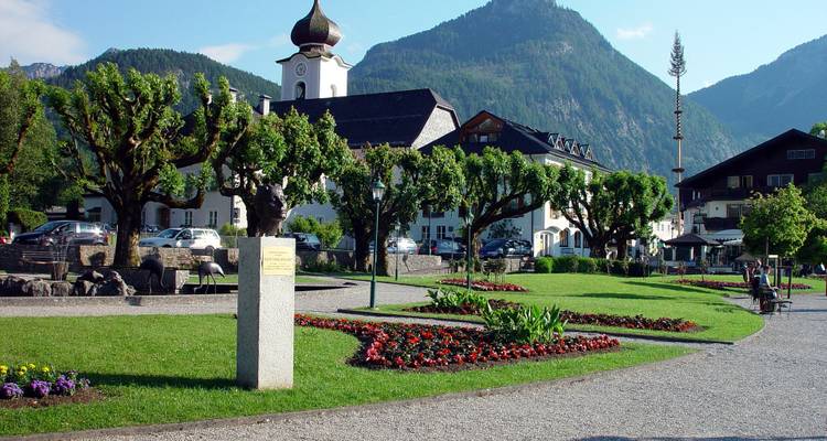 Town square with church and manicured gardens.