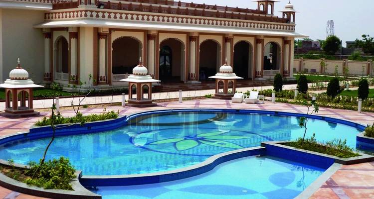 Luxury hotel pool with ornate architecture.