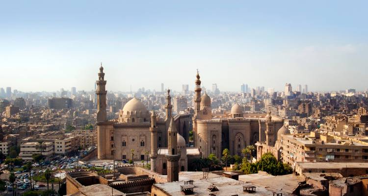 Cityscape with mosques and buildings.