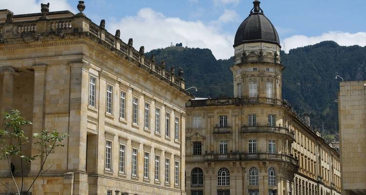 Historic buildings in Bogotá with hills in the background.