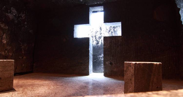 Underground cathedral with a cross-shaped light opening.