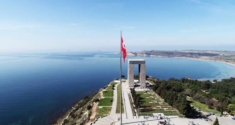 Aerial view of Gallipoli monument with Turkish flag and coastline.