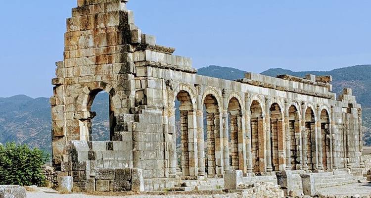 Ruins of an ancient stone structure with arches