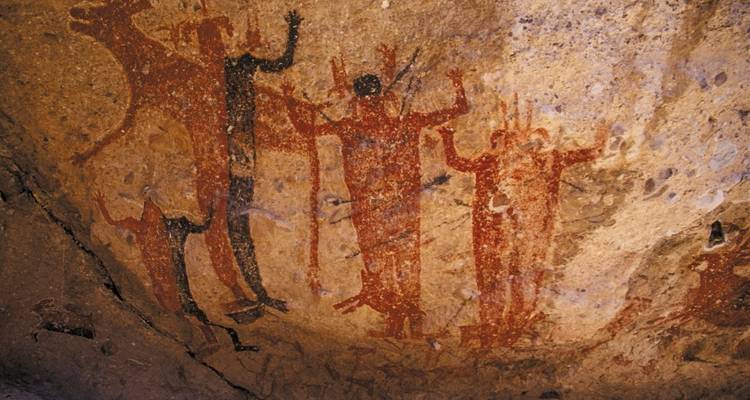 Ancient cave paintings on a rock surface.