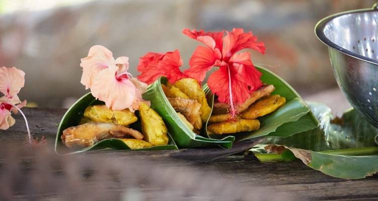 Traditional food presentation with colorful flowers.