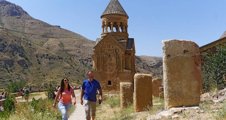 Tourists walking to a historical church with unique architectural design.