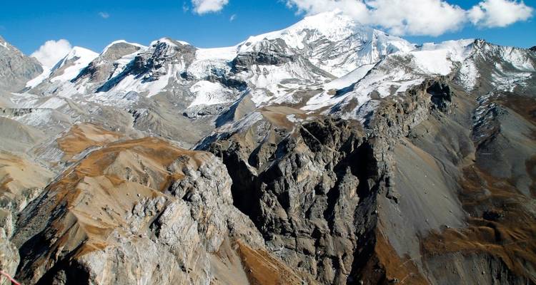 Snow-capped mountains with clear blue sky.