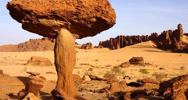 A unique rock formation in a desert setting.