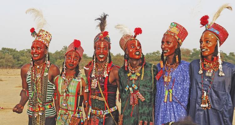 A group of people in colorful traditional attire standing together.