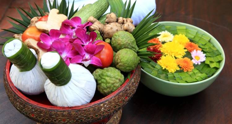 Traditional Thai herbs and flowers arranged in a decorative manner.