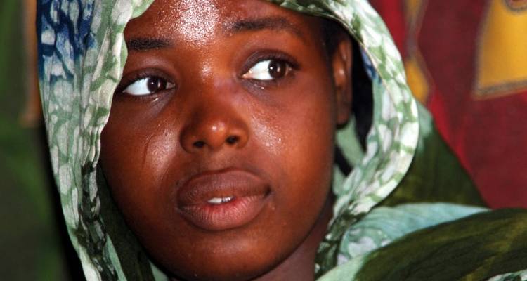 Close-up portrait of a woman with traditional clothing.
