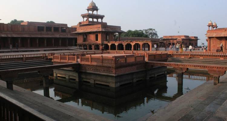 Red-sandstone courtyard and reflecting pool of Fatehpur Sikri’s historic royal complex