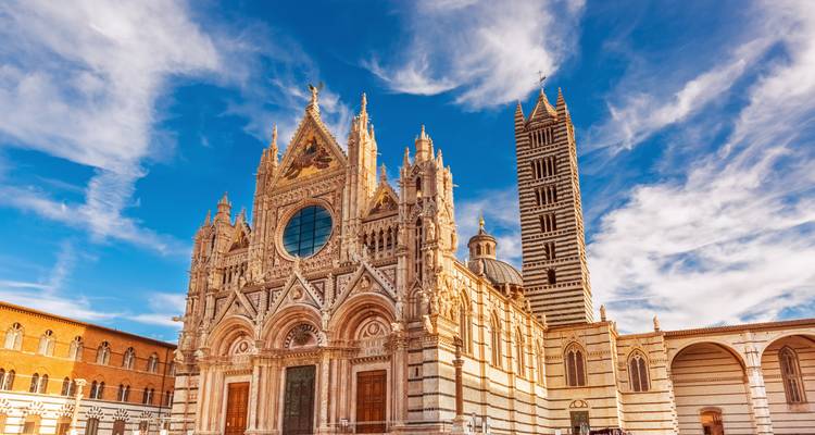 Gothic-style cathedral facade with a blue sky.