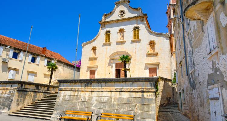 Sunny square with a baroque church façade on Brac Island.
