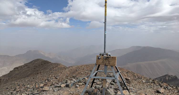 Top of a mountain with a summit marker.