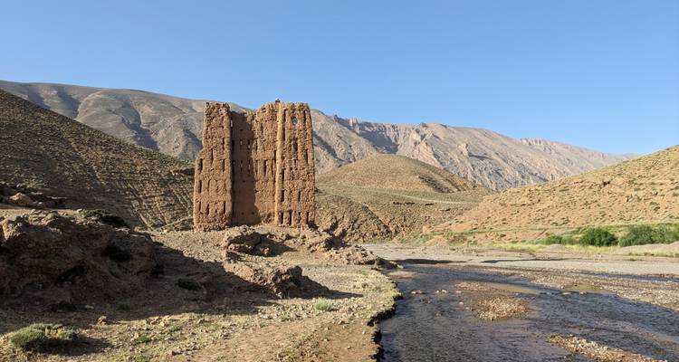 Ruined structure in a barren landscape.