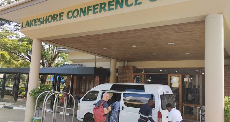 White van parked outside Lakeshore Conference Center.