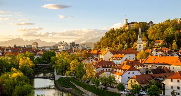 View of Ljubljana, Slovenia with Ljubljana Castle on the hill during a sunny day.