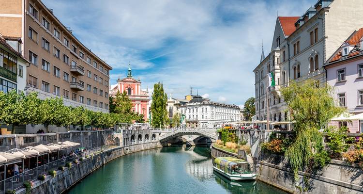 The Triple Bridge and surrounding buildings by the Ljubljanica River in Ljubljana, Slovenia.