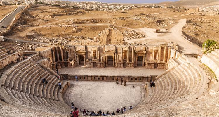 Jerash Roman theater with visitors and expansive views.