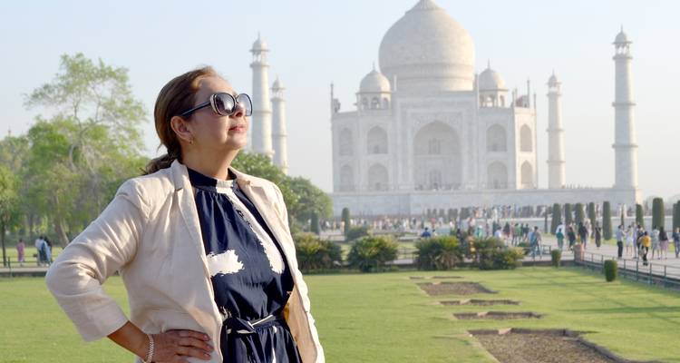 Woman gazing confidently with Taj Mahal in the background.