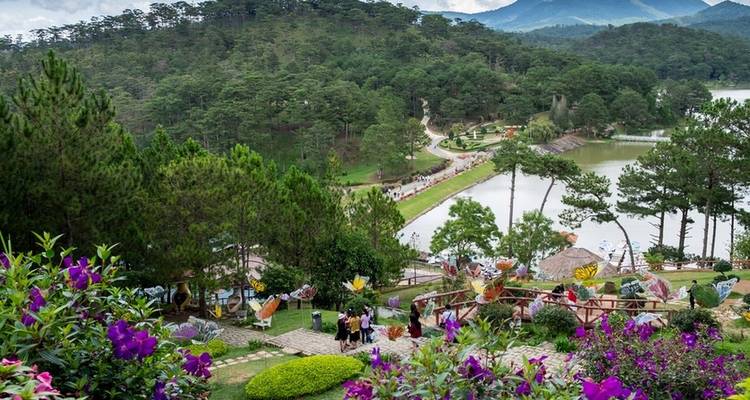 Dense greenery and flowers around a lake