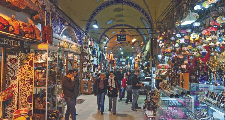 People shopping inside the vibrant Grand Bazaar.