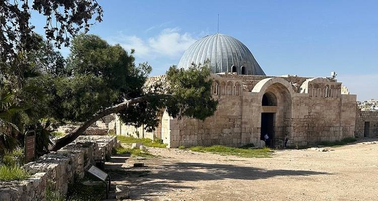 Arched historical structure with a domed roof.