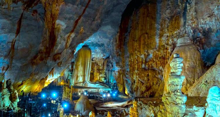 Wide view of a cave with dramatic lighting.