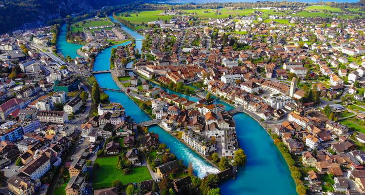 Aerial view of a picturesque town with rivers flowing through.