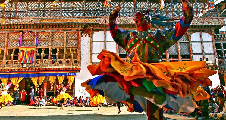 Traditional dance performance in vibrant costumes.
