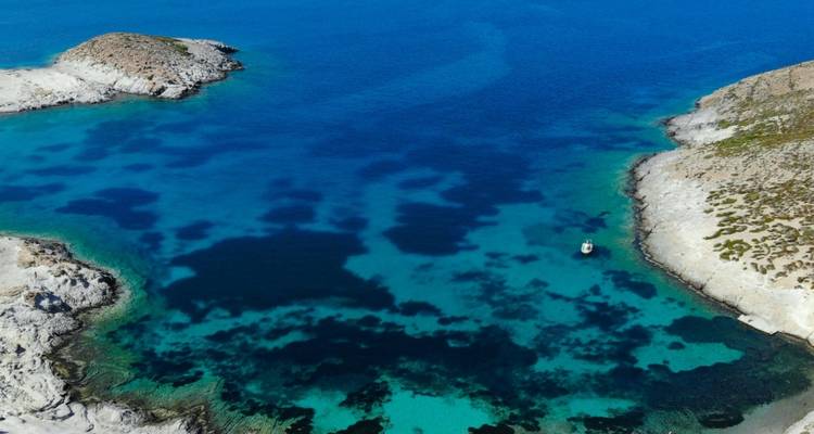 Aerial view of a rocky coastline with turquoise water.