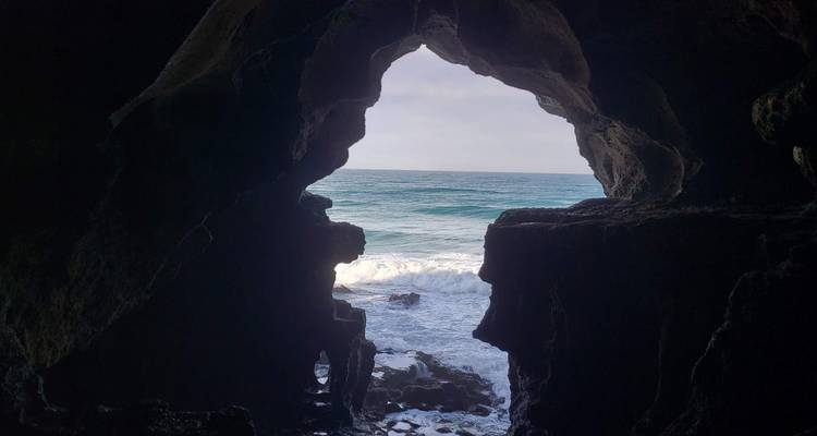 View from inside a cave out to the ocean.