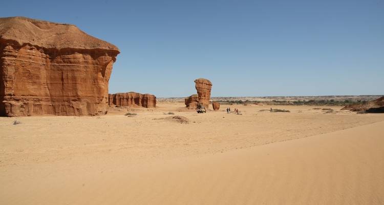 A vast desert landscape with unique rock formations.