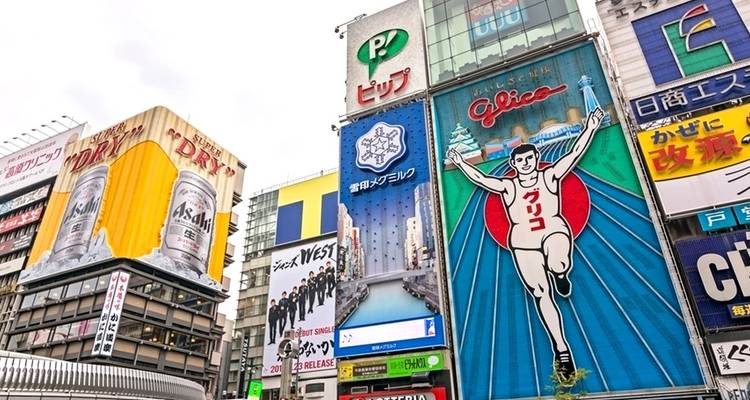 Vibrant commercial street with colorful signboards and advertisements.