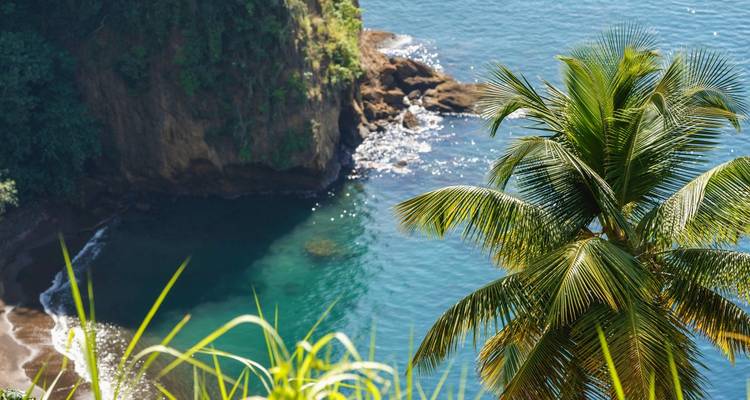 Secluded cove with clear blue water.