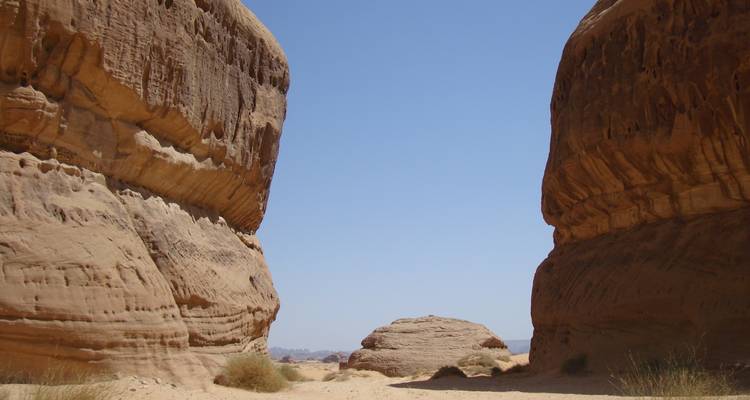 Desert rock formations under a clear blue sky.